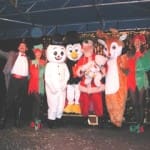 All the mascots do magic and produce Santa from an empty trunk